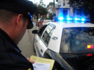 Policeman reviewing paperwork